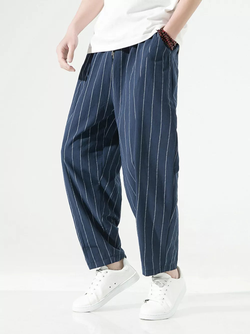Navy striped relaxed fit sweatpants with drawstring and pockets.