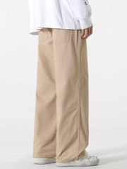 Relaxed fit khaki cotton drawstring pants with back pockets.