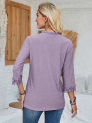 Lavender eyelet blouse with 3/4 sleeves and lace trim cuffs.