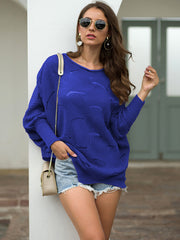 Royal blue knit sweater with boat neck and balloon sleeves, featuring a scalloped pattern.