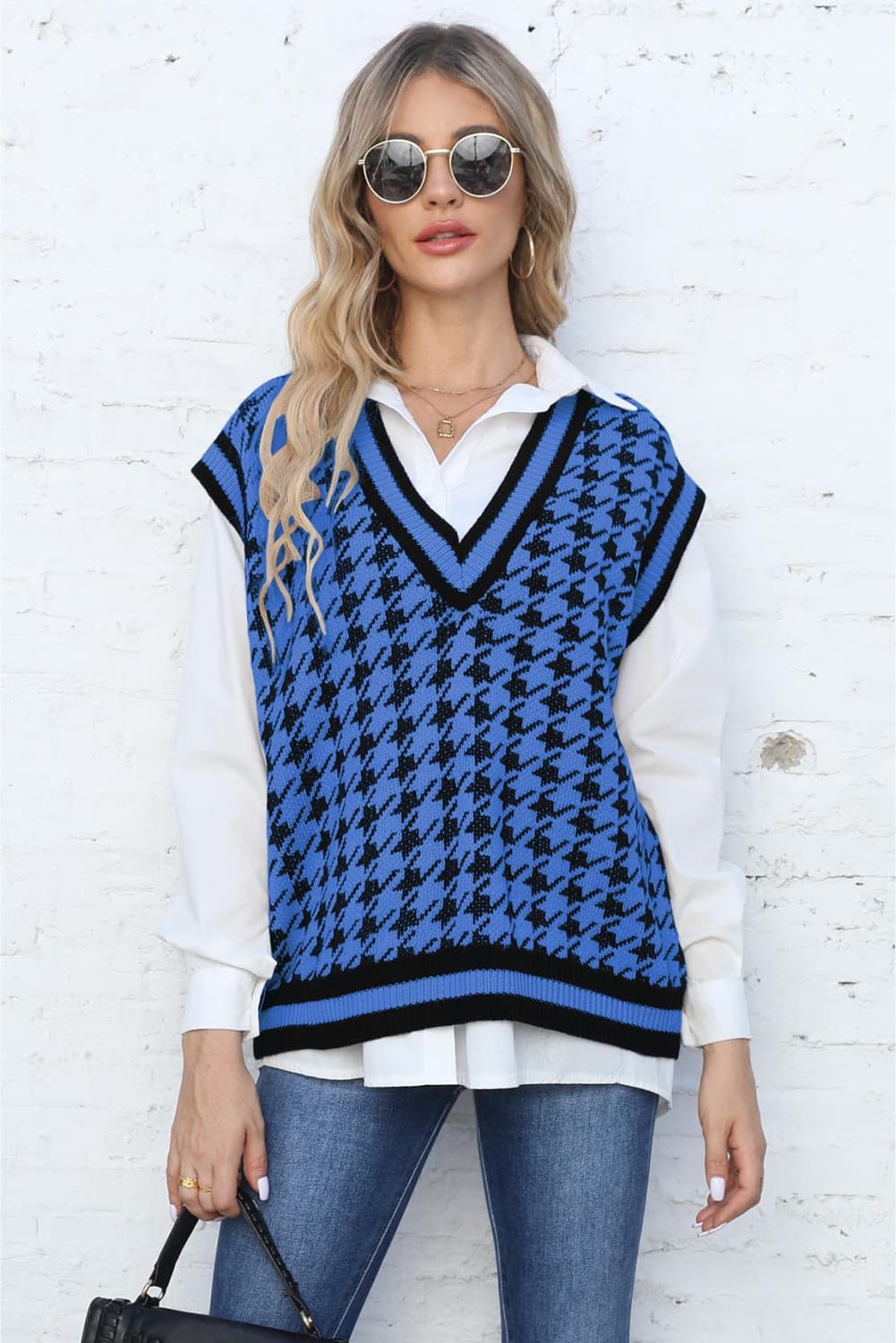 Blue houndstooth knit v-neck vest with black trim, acrylic.