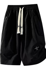 Black relaxed fit chino shorts with drawstring and pockets.