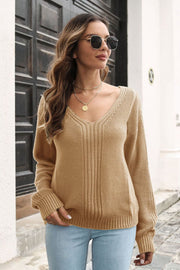 Camel V-neck sweater with vertical ribbed detail and long sleeves.