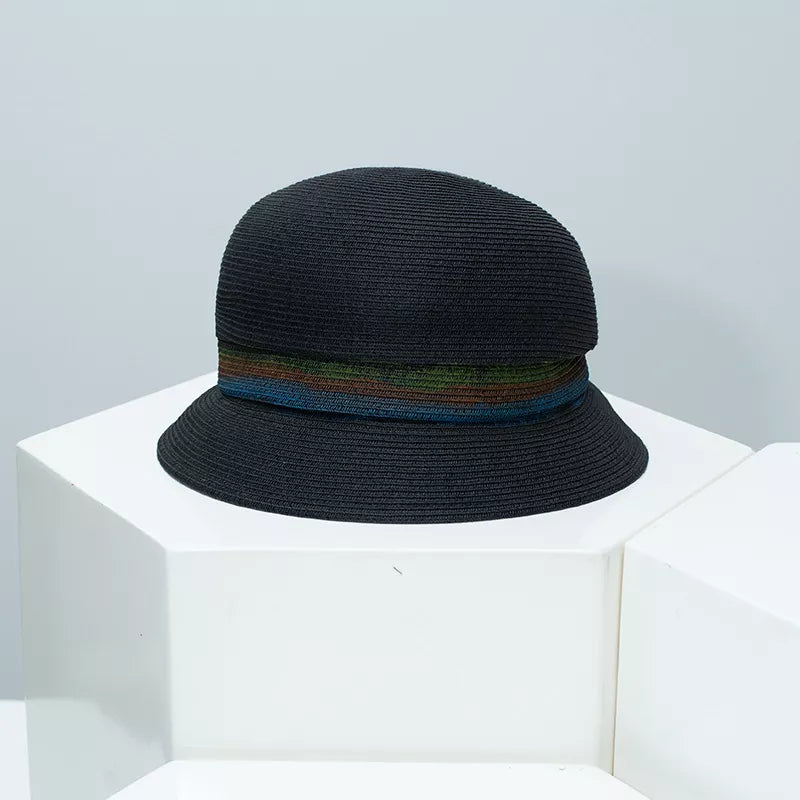 Black straw cloche hat with a vibrant striped band