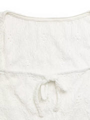 White eyelet lace crop t-shirt with a front tie bow detail.