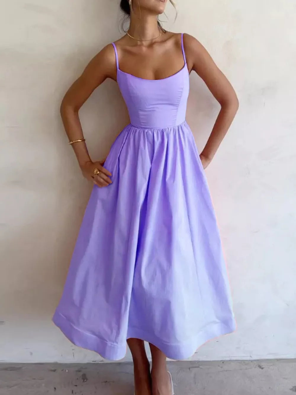 Elegant midi dress in blue purple with adjustable straps and a-line skirt.