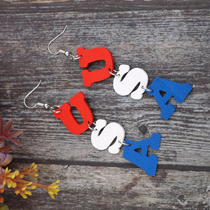 Patriotic USA letter drop earrings in red, white, and blue alloy.