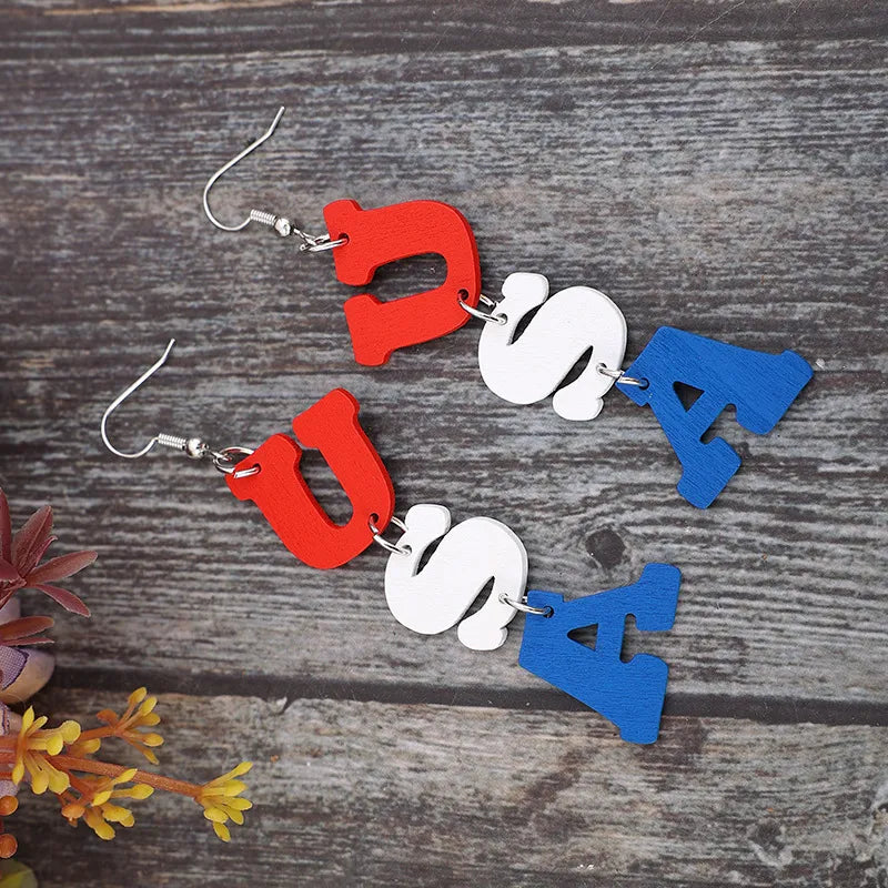 Patriotic USA letter drop earrings in red, white, and blue alloy.