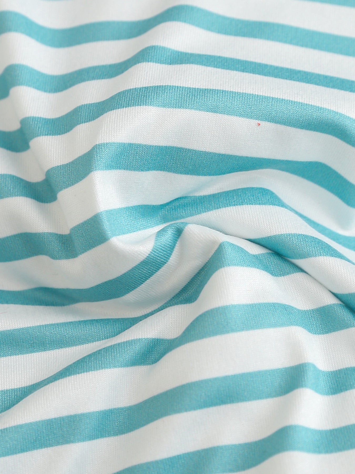Children's pastel blue and white striped polo shirt fabric detail