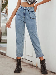 Light wash barrel leg jeans with unique pocket detail and cuffed hems.