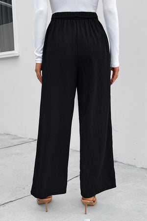 Black high-waist tie palazzo trousers with a relaxed fit and wide leg.