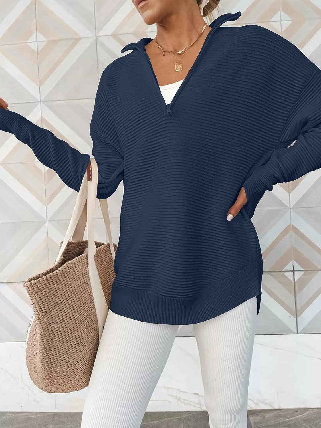 Navy ribbed knit pullover with funnel neck and quarter zip, long sleeves, relaxed fit.
