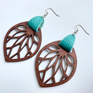 Teal leather and wood leaf cutout dangle earrings with boho style.