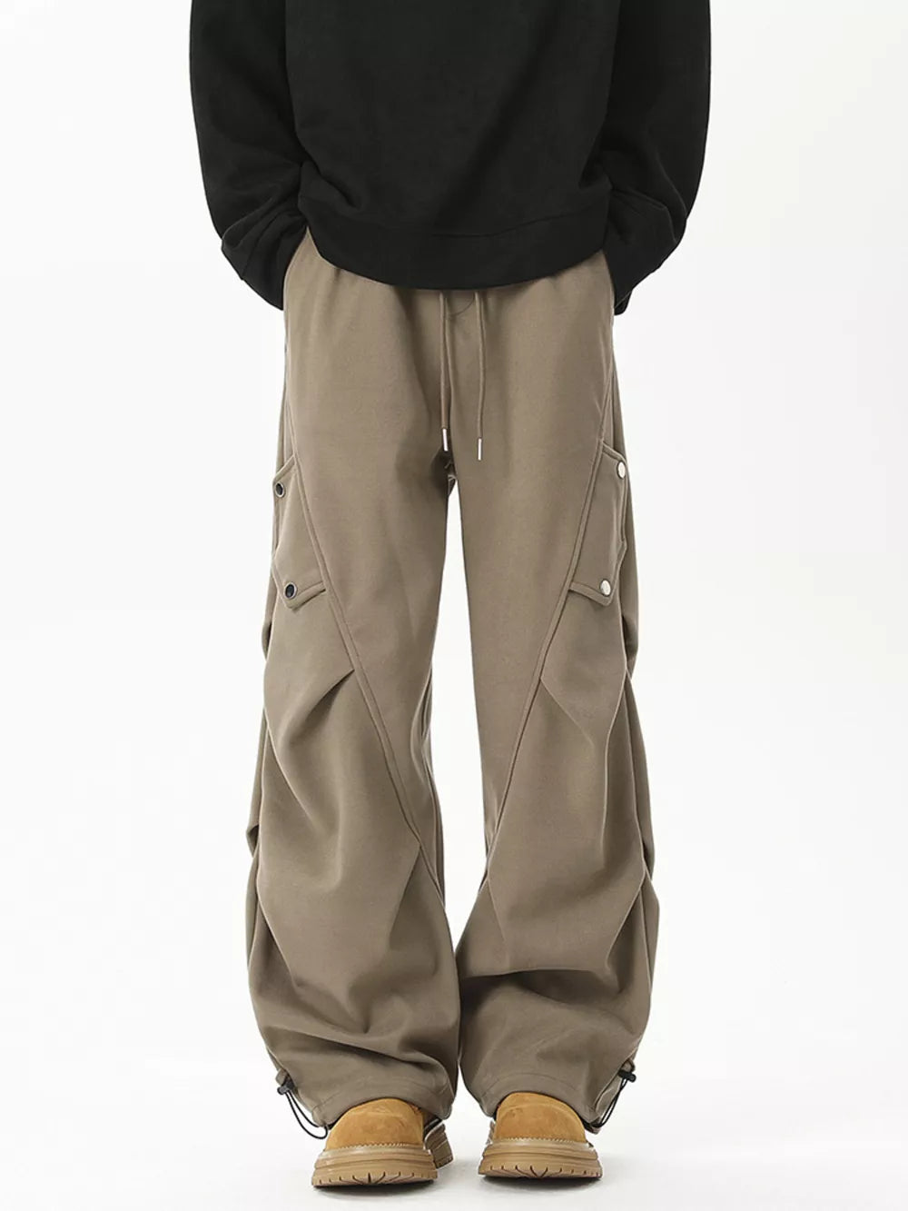 Khaki cargo sweatpants with drawstring waist and button flap pockets.