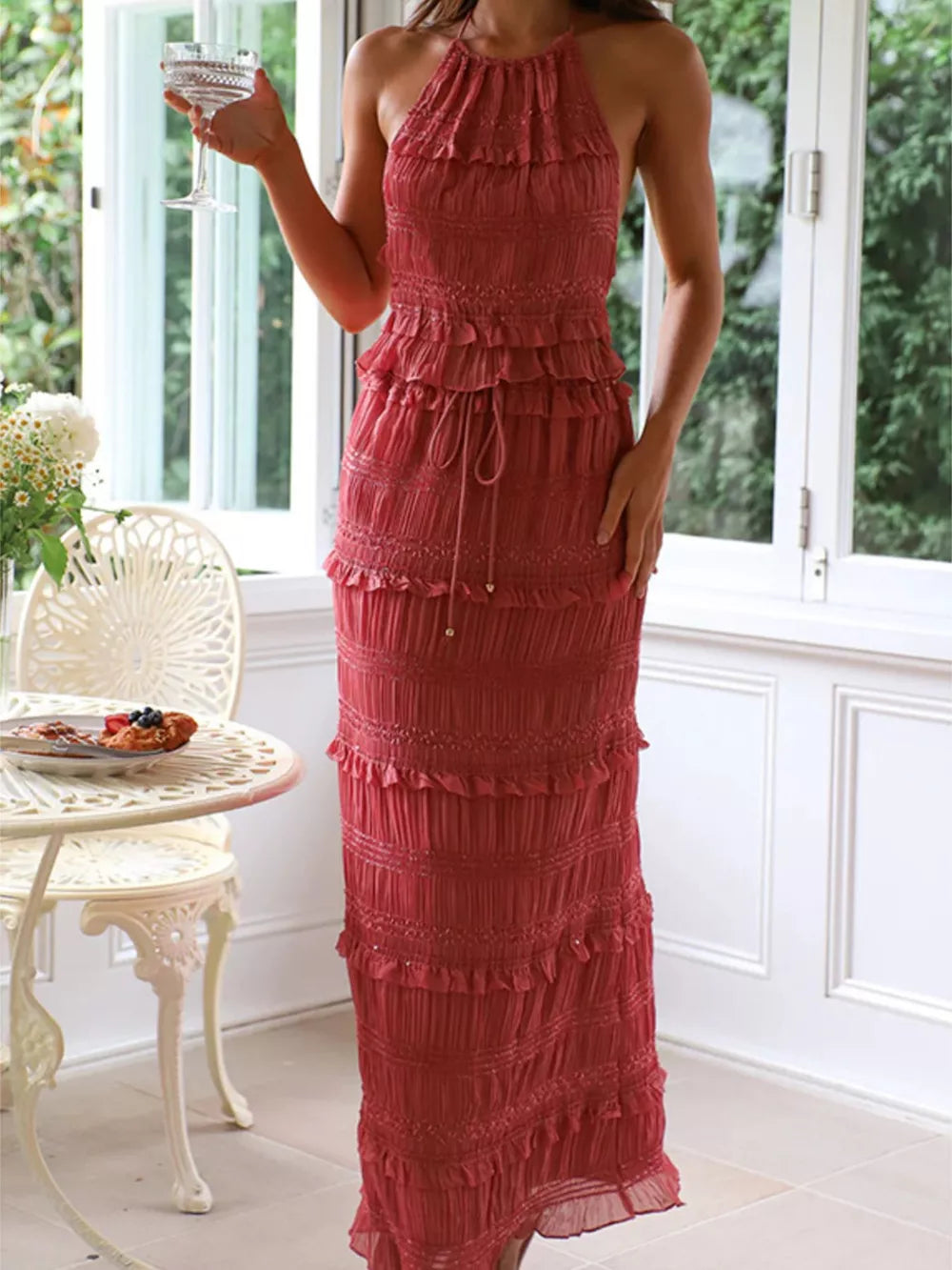 Brick-red halter neck smocked tiered maxi dress with drawstring waist.