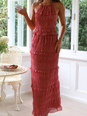 Brick-red halter neck smocked tiered maxi dress with drawstring waist.