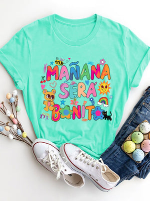 Aqua graphic tee with Mañana Serà Bonito text and playful illustrations.