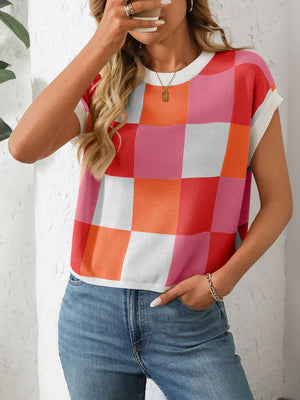 Checkerboard knit cap sleeve top in pink, orange, red, and white.