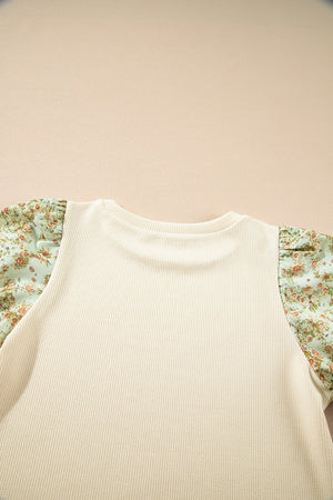 Beige ribbed knit top with floral puff sleeves and crew neck.