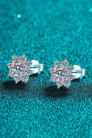 Silver blossom moissanite stud earrings with sparkling center stones.