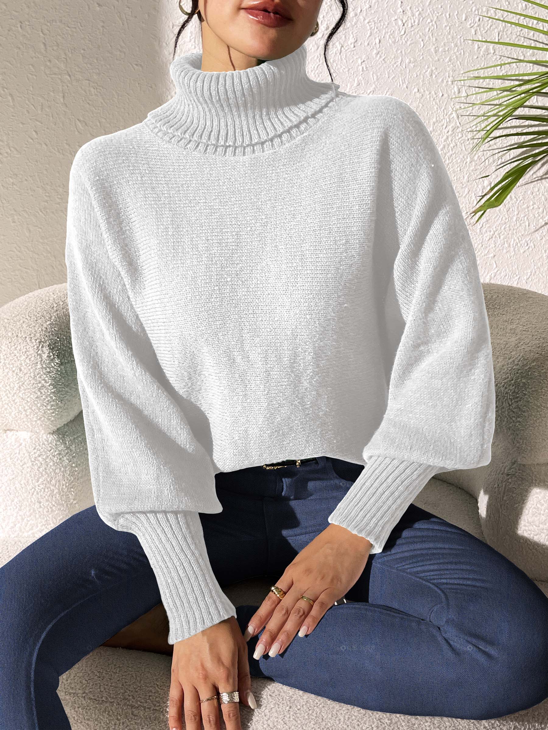 White balloon sleeve turtleneck sweater with ribbed cuffs and collar