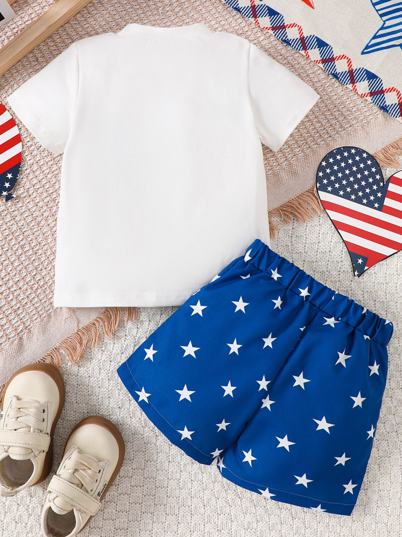 White baby tee and blue star print shorts ensemble, comfortable cotton outfit.