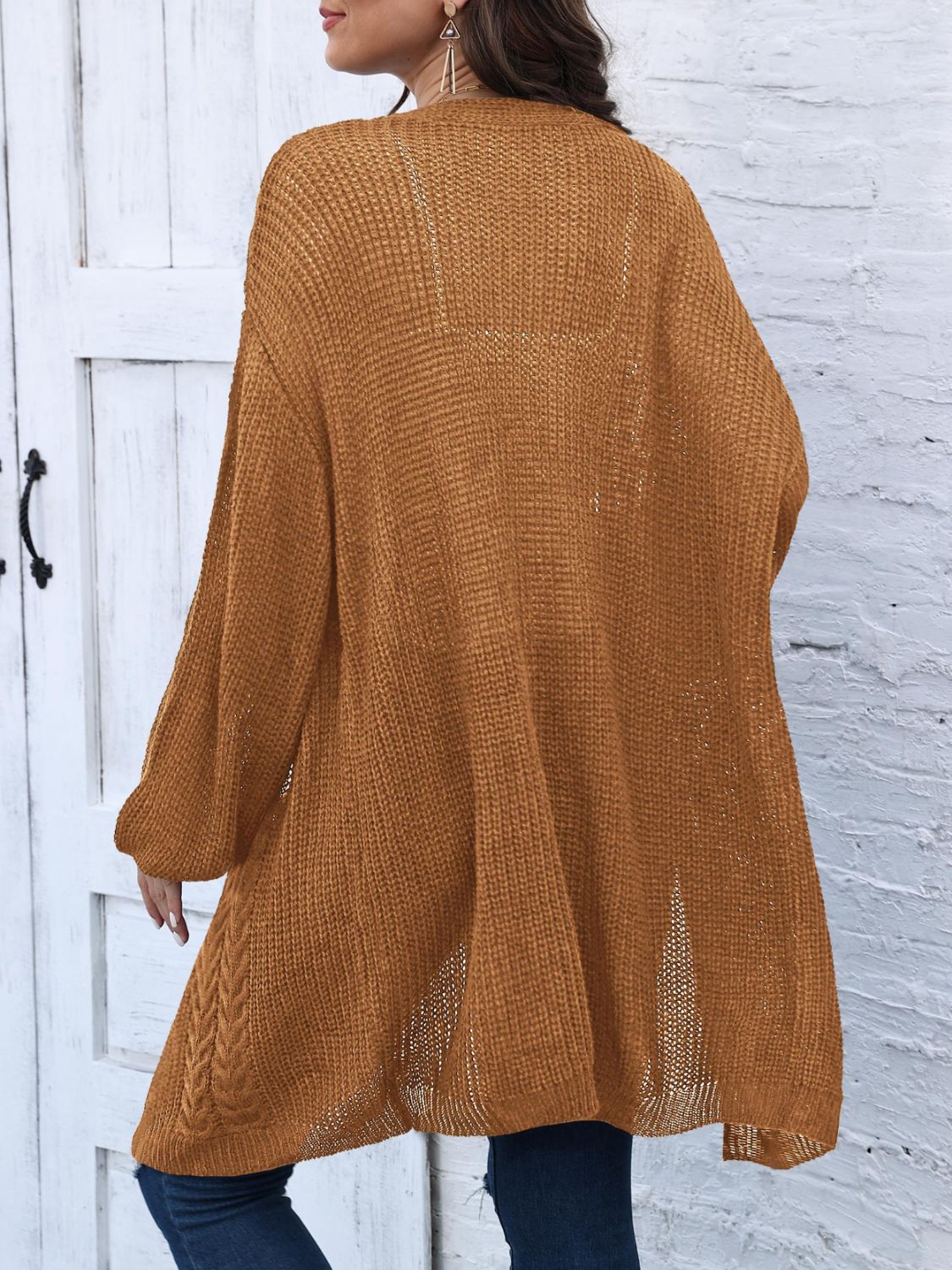 Caramel cable knit cocoon cardigan with open knit detail and braided hem.