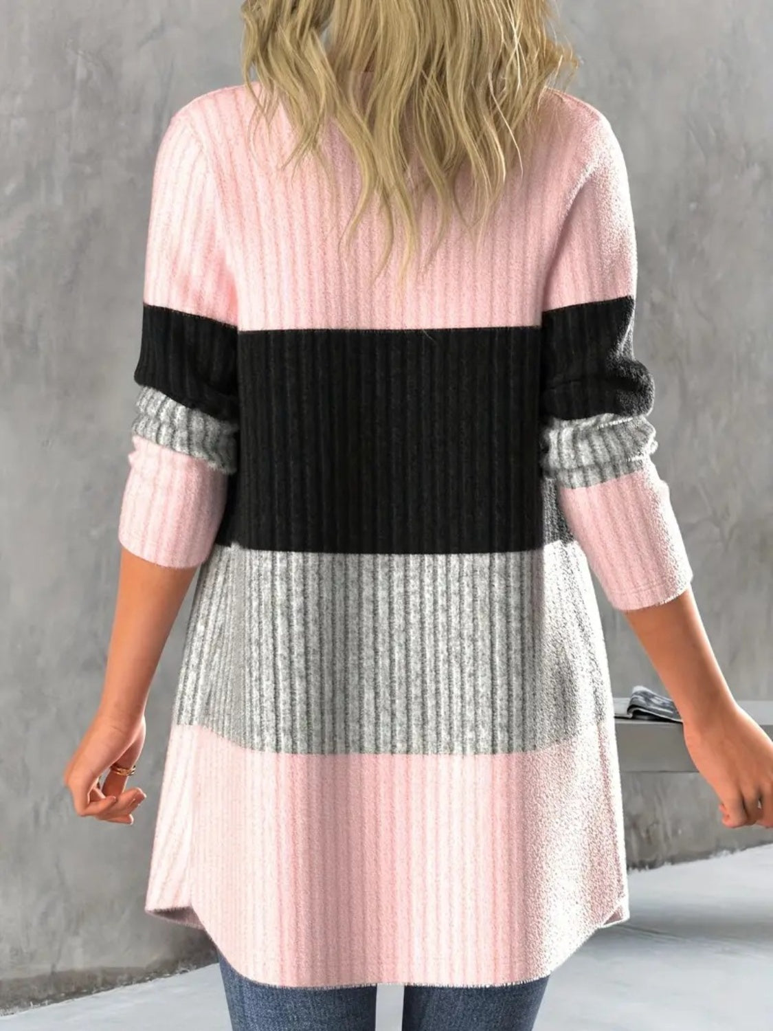 Monochrome block ribbed cardigan in pink, black, and grey stripes.
