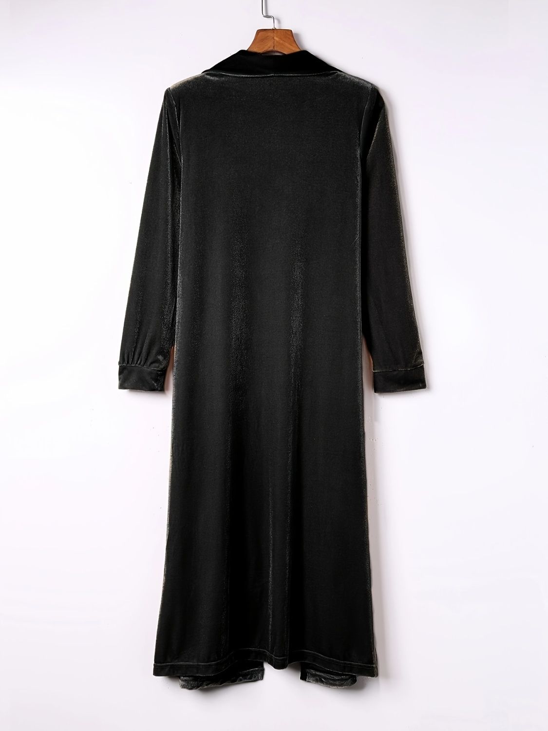 Black velvet duster coat with fluid silhouette, long sleeves and notched collar.