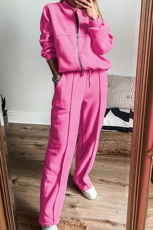 Fuchsia pink seamed jogger set with zip-up bomber jacket and drawstring pants.