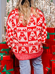 Checkerboard candy cane intarsia sweater in red and white acrylic with crew neck.