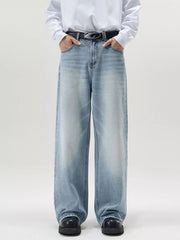 Men's wide-leg light blue wash denim jeans with a relaxed fit.