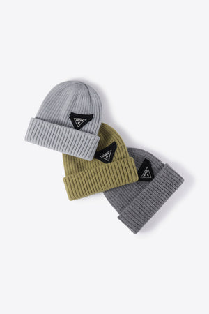 Ribbed acrylic beanies in Steel and Green with black triangle patch detail