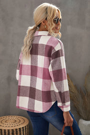 Oversized shacket in pink and burgundy plaid with button-down front and patch pocket detail.