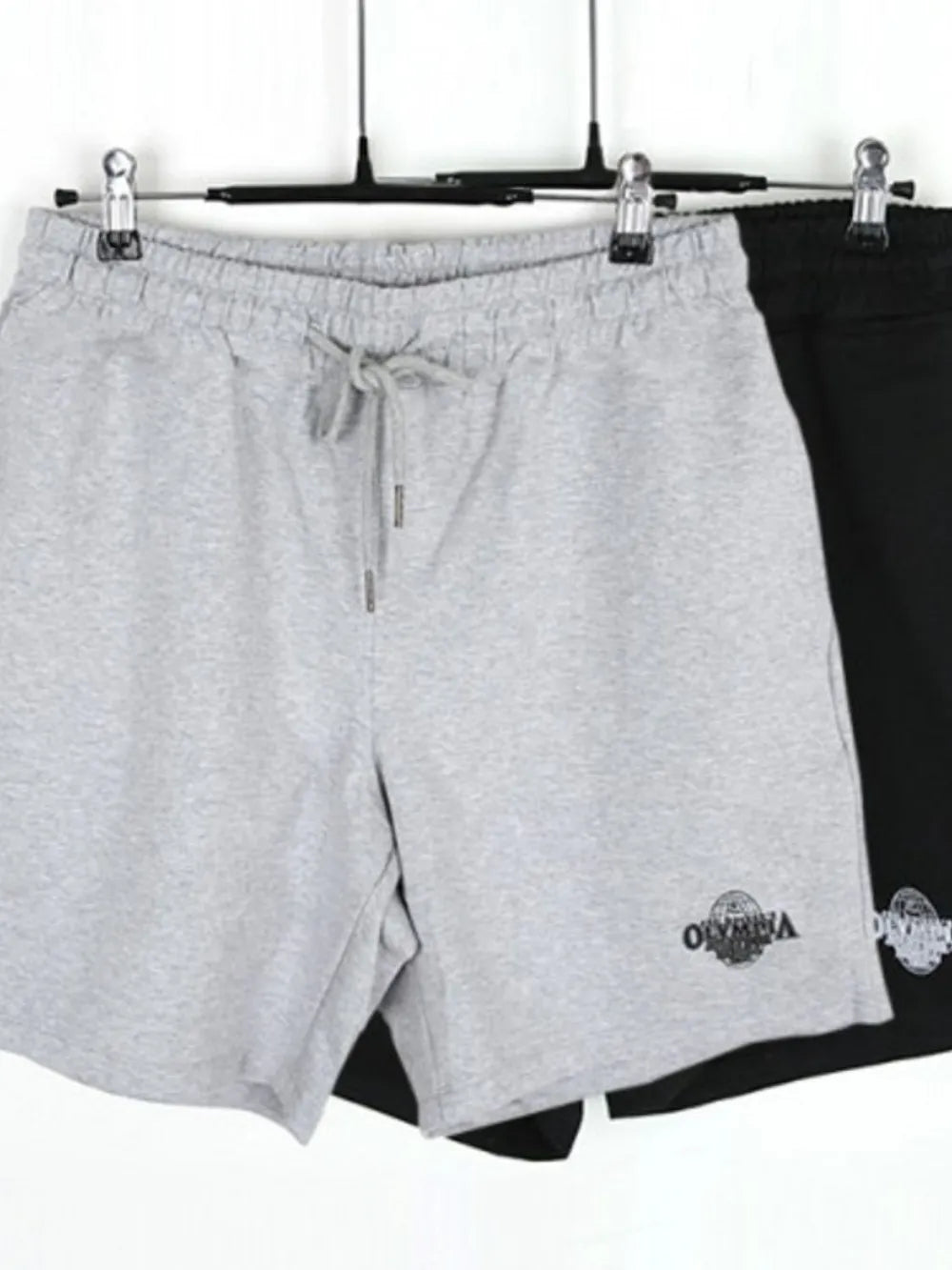 Grey jersey shorts with drawstring waist and Olympia logo detail.