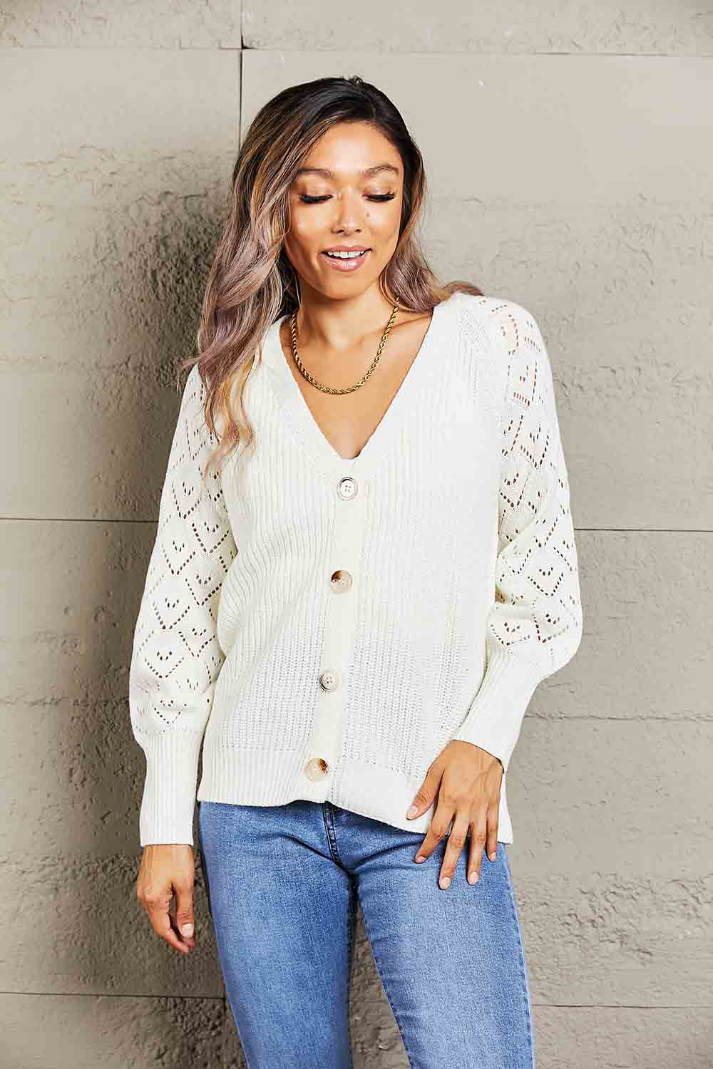 White diamond knit button-down cardigan with V-neck and balloon sleeves