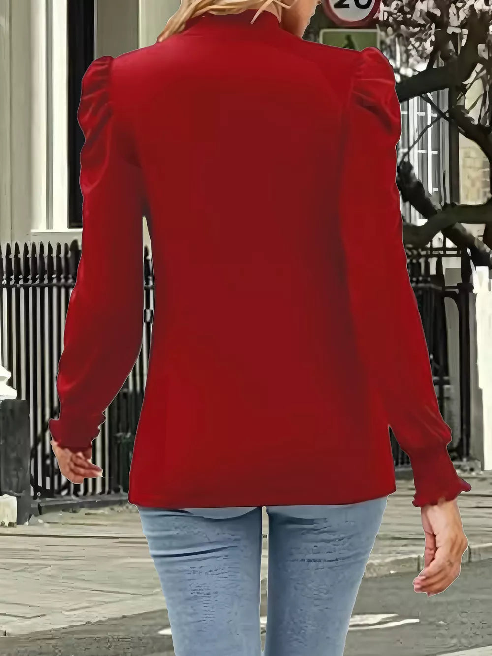 Red maternity overshirt with mock neck and gathered puff sleeves.