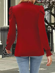 Red maternity overshirt with mock neck and gathered puff sleeves.