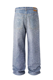 Ombré crystal embellished wide leg jeans in dark wash denim with scattered rhinestones.