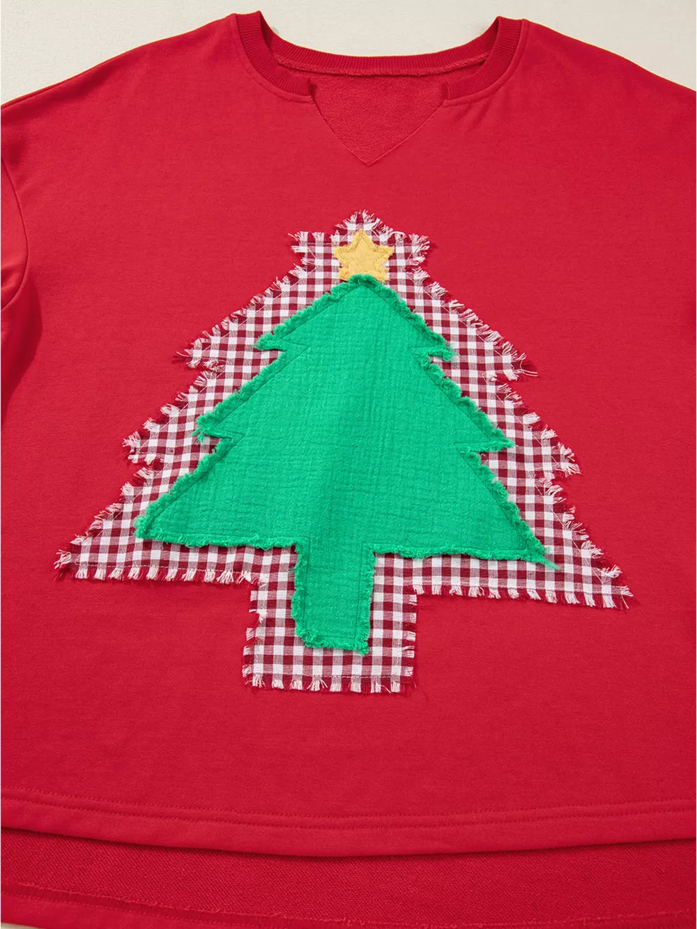 Red cotton sweatshirt with festive plaid Christmas tree applique and yellow star detail.