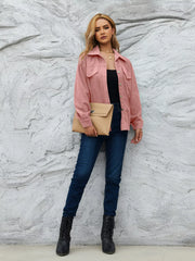 Pinkish corduroy button-up jacket with chest pockets and a collared neckline.
