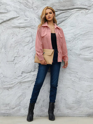 Pinkish corduroy button-up jacket with chest pockets and a collared neckline.