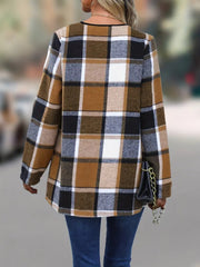 Asymmetric plaid drape front jacket in caramel, black, white, and brown plaid.