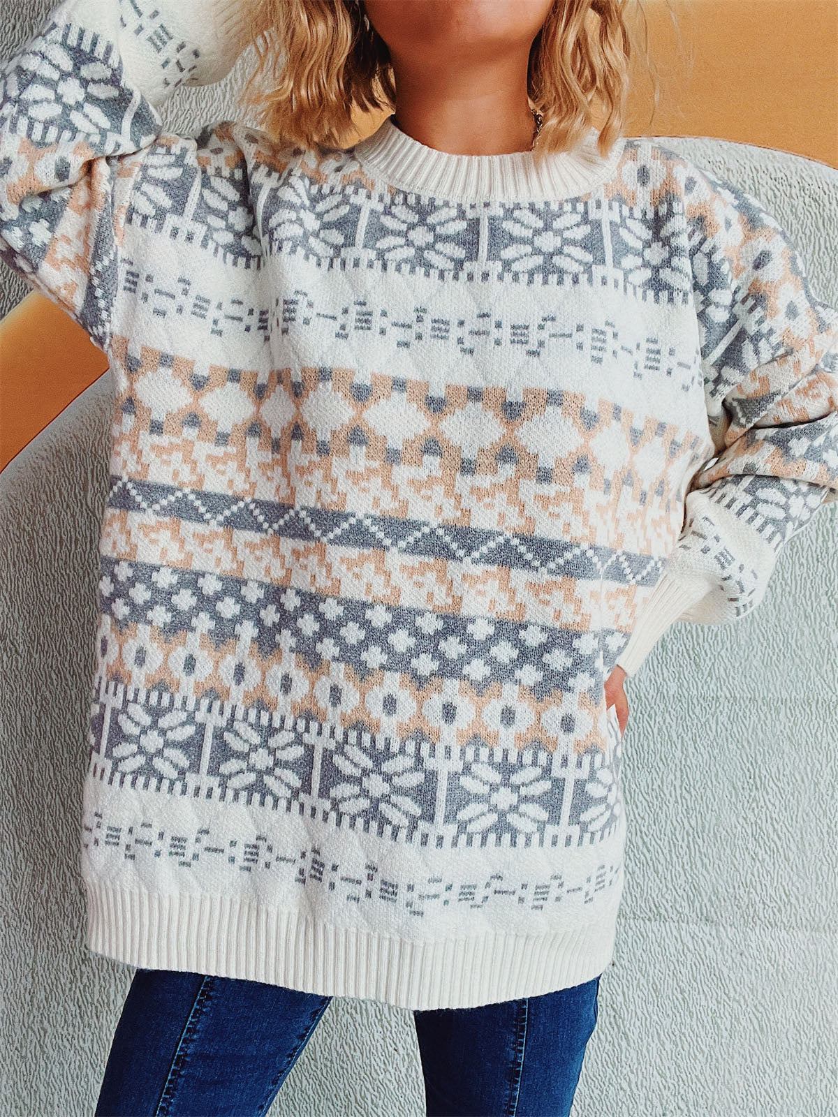 Fair Isle knit oversized sweater in white with grey and tan geometric pattern.