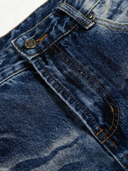 Men's light blue vintage wash wide leg jeans detail showing button and stitching