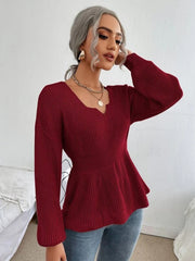 Wine peplum knit sweater with scallop neckline and long sleeves.
