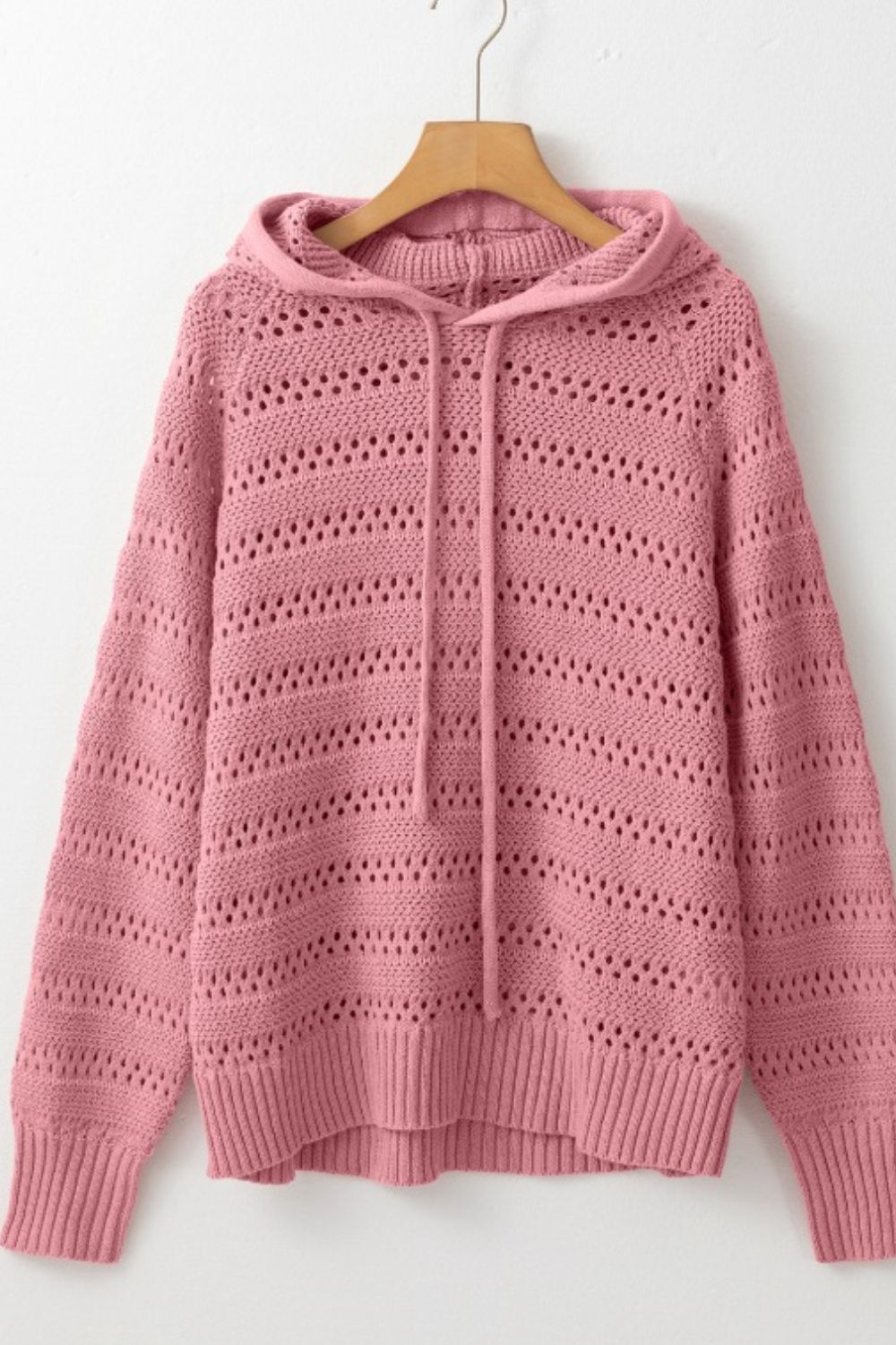 Dusty pink openwork knit hoodie with drawstring and ribbed cuffs and hem.