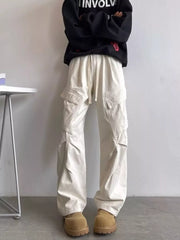 Relaxed fit cargo pants in apricot with drawstring waist and multi pockets.