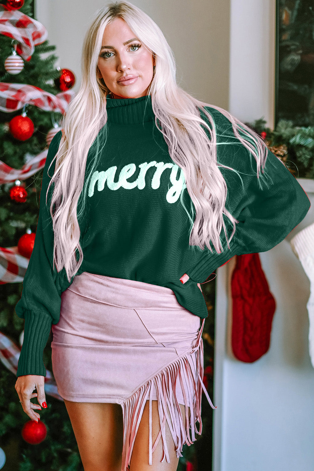 Dark green acrylic turtleneck sweater with white "merry" graphic and dolman sleeves.