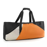 Modern color block travel bag in orange, black, and white with dual handles and a zip closure.